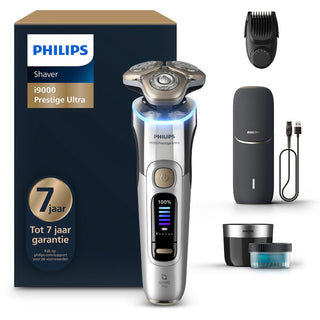 De Philips Shaver i9000 Prestige Ultra Elektrisch Scheerapparaat set bevat een scheerapparaat, trimmerkop, laadcase en meer. Ontworpen om huidirritatie te verminderen, met 7 jaar garantie en 100% laadstatus op het display.