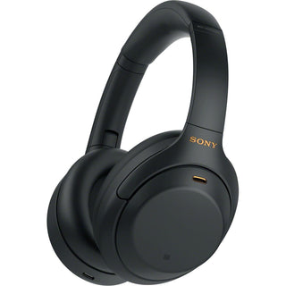 Een paar zwarte Sony WH-1000XM4 draadloze over-ear hoofdtelefoons met ruisonderdrukking, oorschelpkussens en een gestroomlijnd ontwerp.