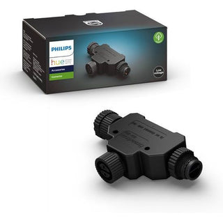 Het Philips Hue T-verlengstuk voor buiten van Philips is een zwarte laagspanningsconnector met drie schroefpoorten, afgebeeld voor de verpakking met het Philips-logo en productgegevens. Perfect voor eenvoudige buitenverlichting verlengkabel aansluitingen.