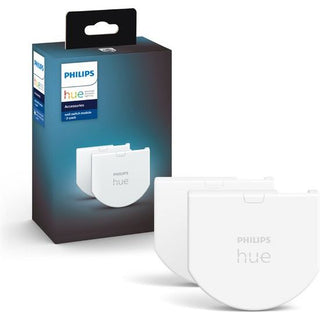 Een Philips Hue wandschakelaar module slimme verlichting accessoire - 2 stuks van Philips wordt getoond met twee witte modules voor slimme verlichting aan de voorkant en de zwarte productdoos met merklogo en details zichtbaar op de achtergrond.