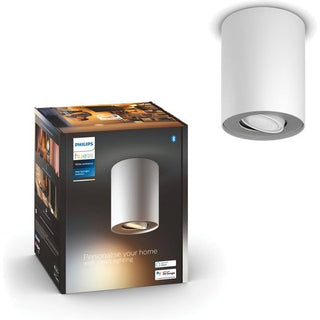Een Philips Hue Pillar opbouwspot - warm- tot koelwit licht - 1-spot en de bijbehorende doos, met daarop het Philips-logo, een afbeelding van de lamp en slimme verlichtingsdetails.