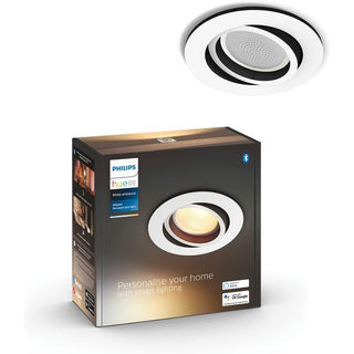 Een Philips Hue Milliskin inbouwspot en zijn doos, met de productafbeelding, het Philips-logo en belangrijke functies zoals Bluetooth-bediening en Google Assistant-compatibiliteit.