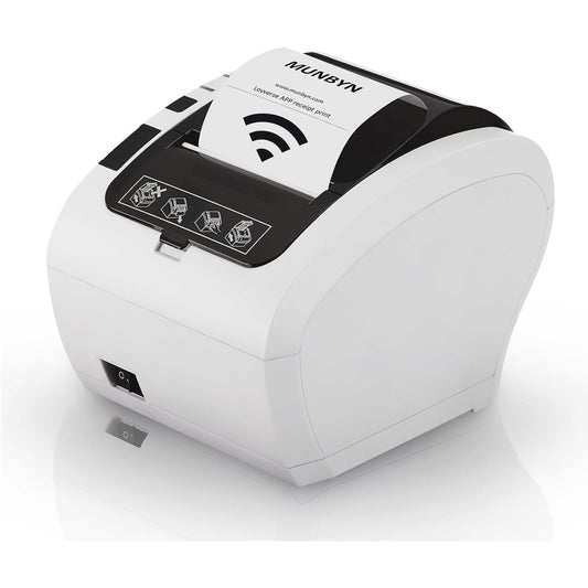 Een MUNBYN Thermische Bonprinter 80mm - WiFi & USB + Ethernet Bonprinter staat op een plat oppervlak, heeft een witte behuizing, zwarte knoppen met pictogramlabels aan de bovenkant, een papierrolsleuf van 80mm en draadloze connectiviteit die wordt aangegeven door een Wi-Fi-symbool.