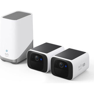 De EUFY Security SoloCam S220 2-Cam Kit bevat twee draadloze buitencamera's en een wit basisstation, allemaal weergegeven op een wit oppervlak, voor geavanceerde bescherming buitenshuis.